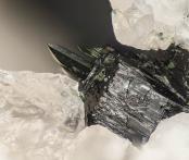 Dark green aegerine crystals (to .45 mm) growing epitaxially on a black arfvedonite crystal: Washington Pass, Okanogan Co., WA
FOV: 1.69 mm